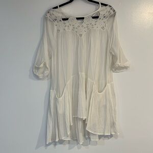 Free people vintage gauze white dress with double pockets.